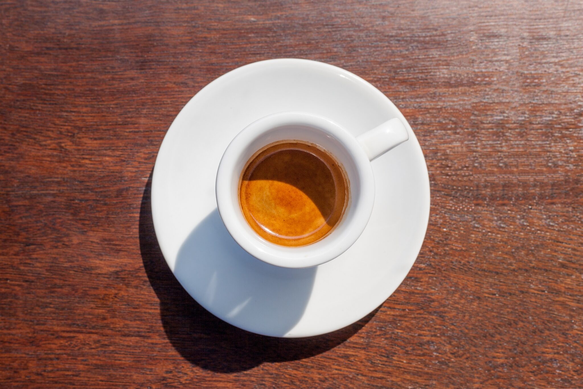 Cup,Of,Espresso,Coffee,On,A,Wooden,Table
