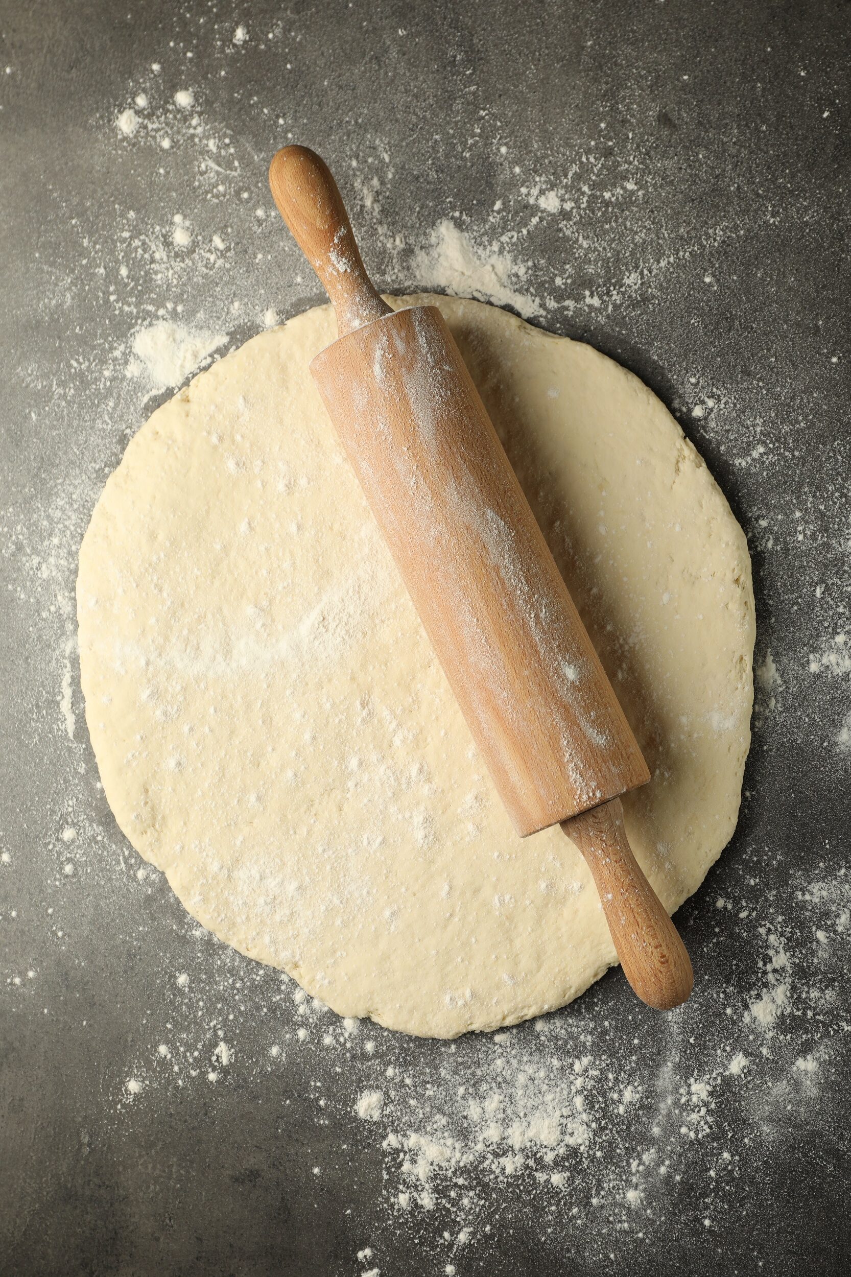 Fresh,Dough,And,Rolling,Pin,On,Grey,Table,,Top,View
