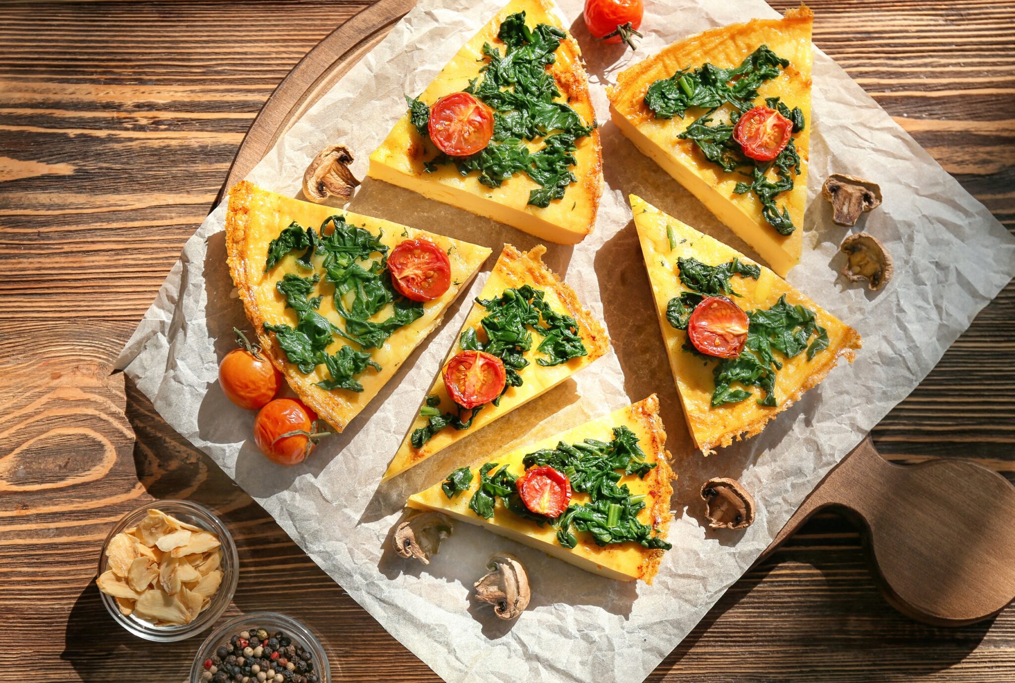 Pieces,Of,Tasty,Frittata,With,Spinach,On,Table