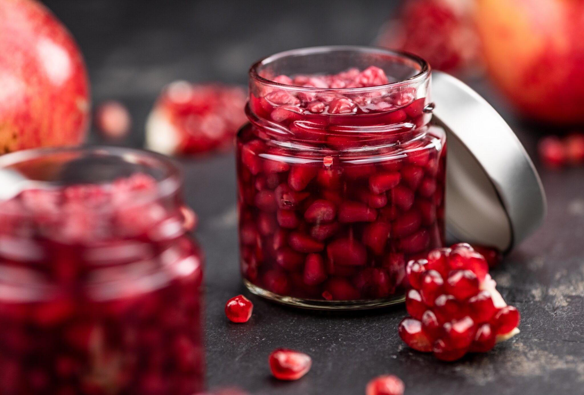 Portion,Of,Healthy,Preserved,Pomegranate,Seeds,On,A,Slate,Slab
