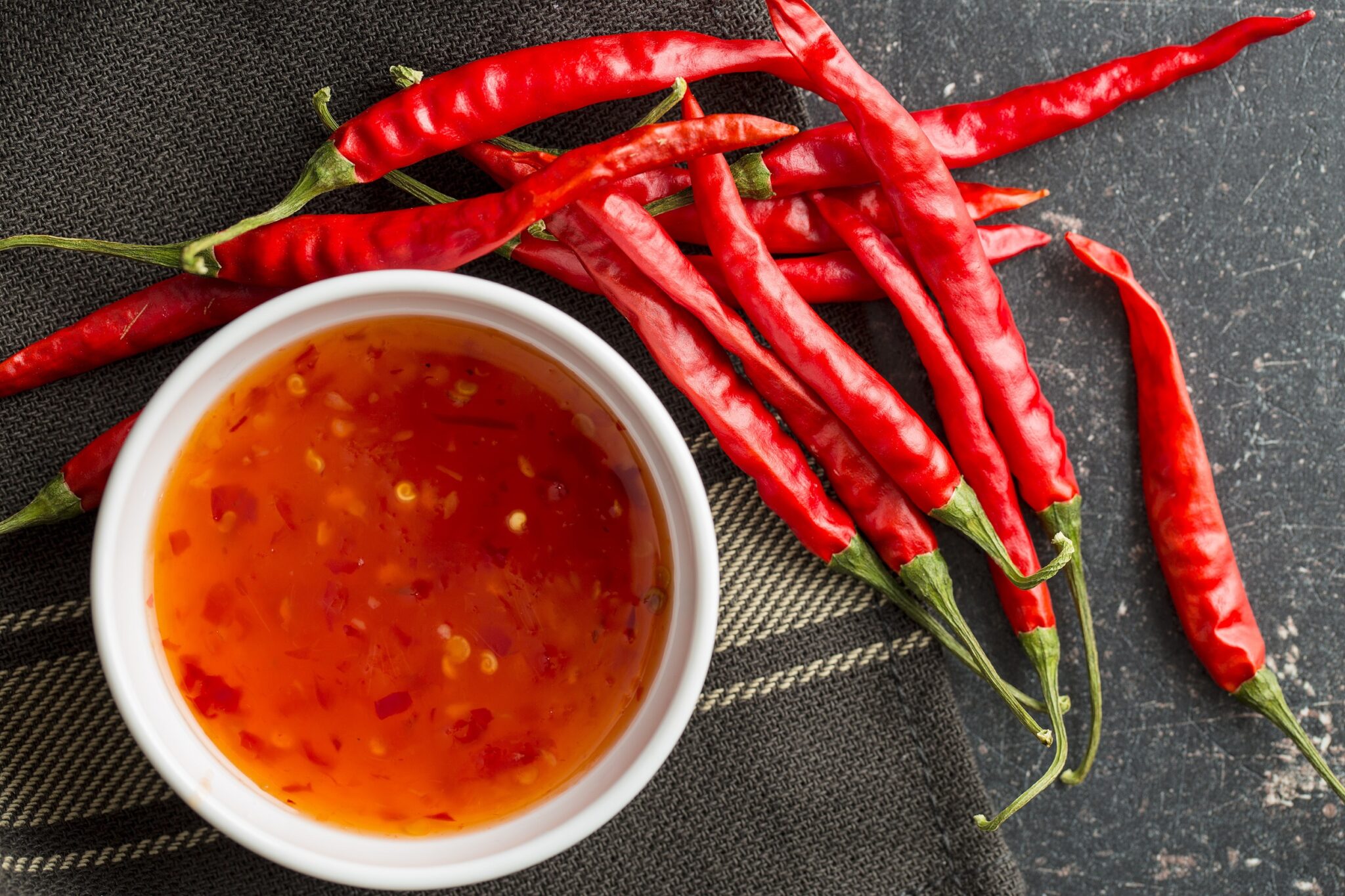 Red,Chili,Peppers,And,Chili,Sauce.,Top,View.