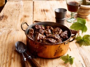 Serving,Of,Tasty,Venison,Deer,Goulash,In,A,Copper,Pot