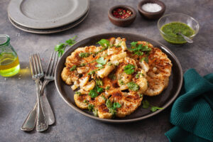 Cauliflower,Steaks,With,Herb,Sauce,And,Spice.,Plant,Based,Meat