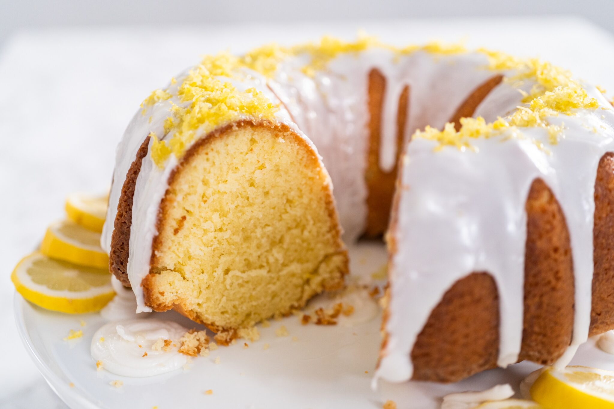 Sliced,Lemon,Bundt,Cake,Decorated,With,Lemon,Zest,On,A