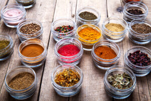Spices,In,Jars,On,Wooden,Background.,Food