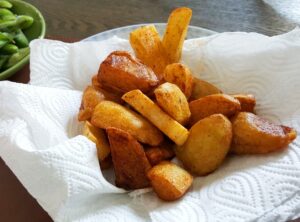 French,Fries,And,Peas,On,Wooden,Table.