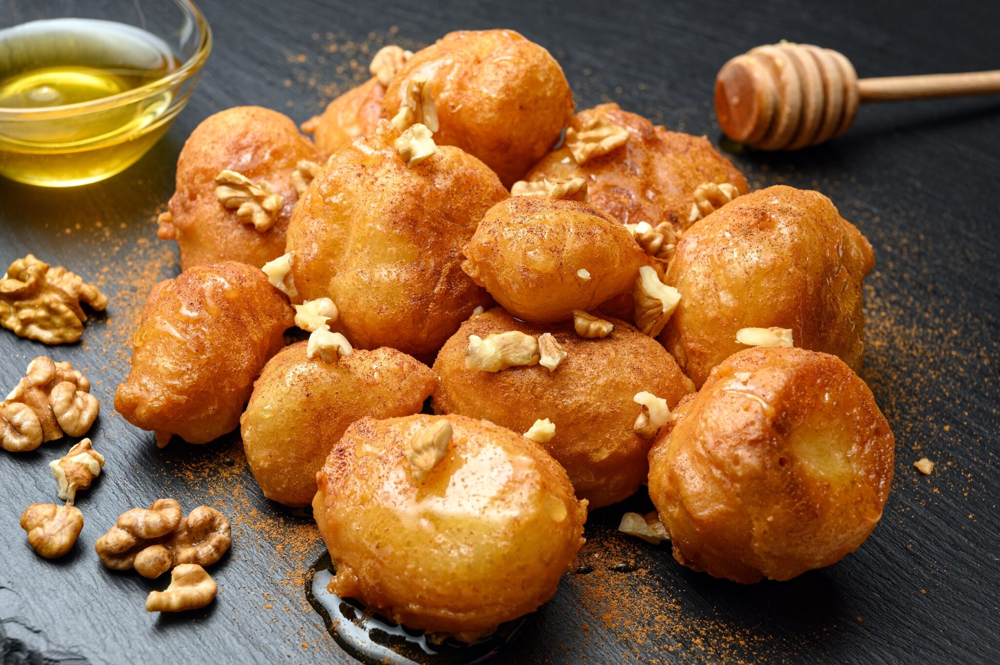 Homemade,Lokma,Served,With,Honey,,Nuts,And,Cinnamon,On,Black
