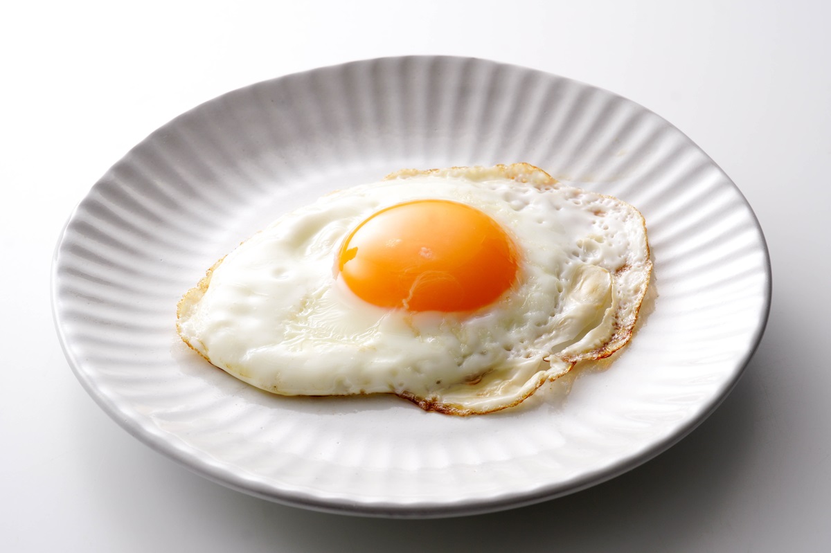 Sunny,Side,Up,Fried,Egg,On,White,Plate