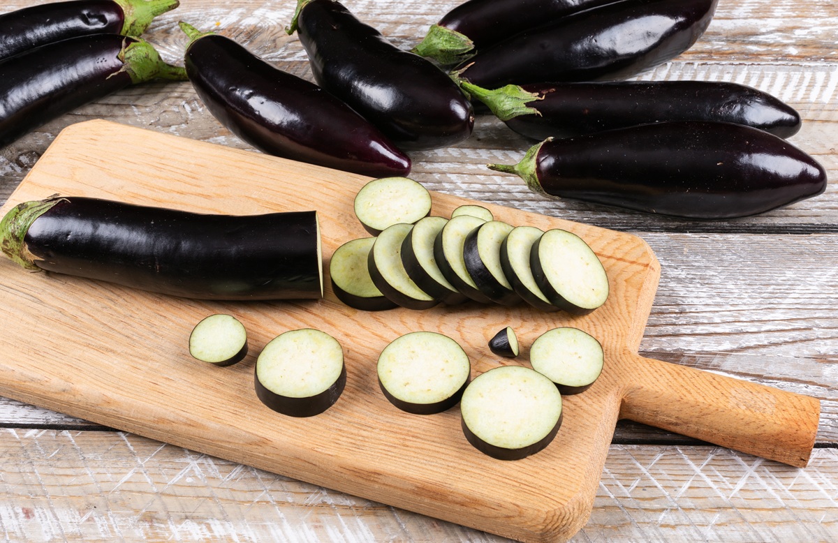 Eggplant,And,Chopped,One,On,A,Cutting,Board,And,Wooden