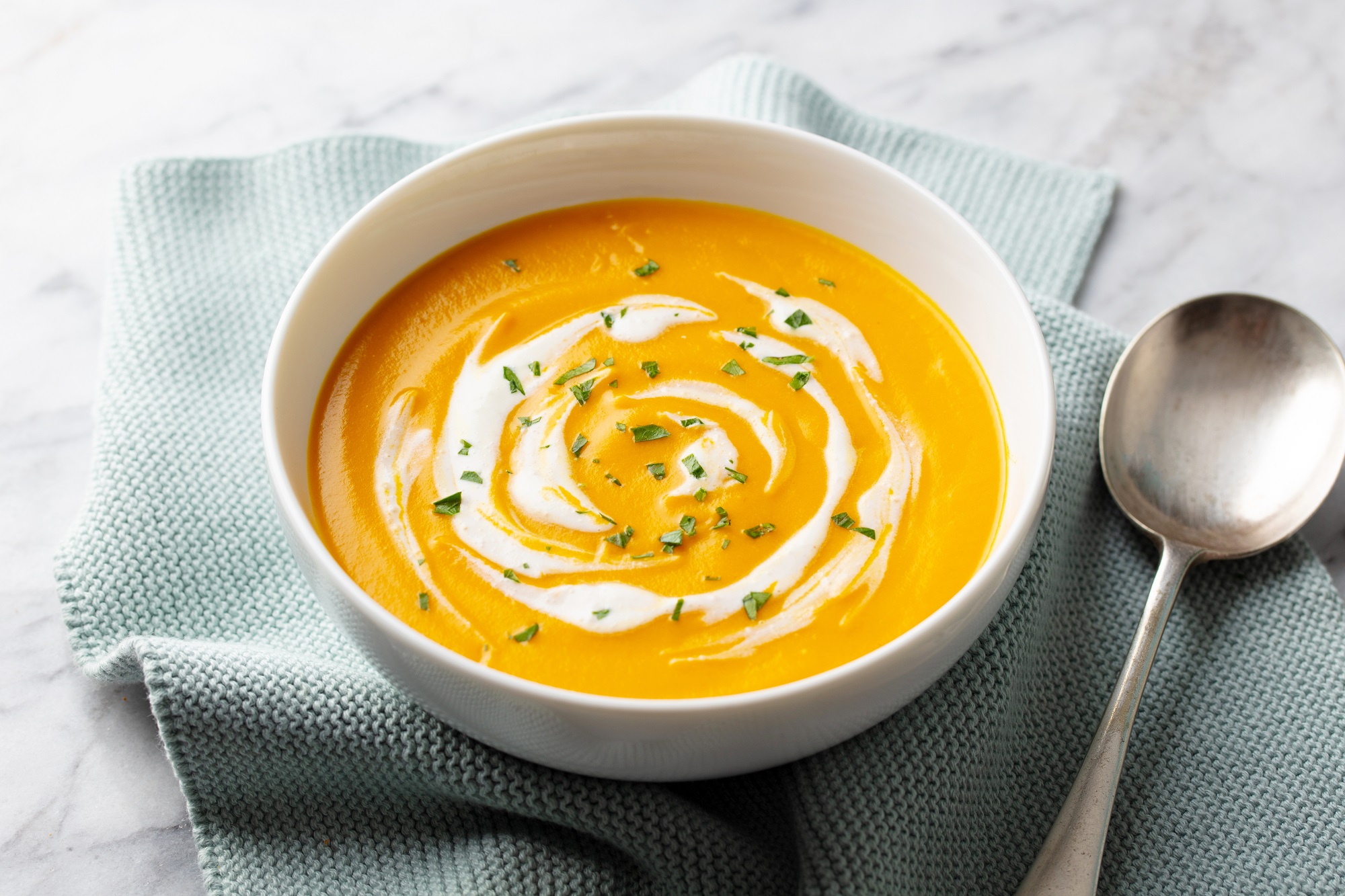 Healthy,Creamy,Pumpkin,Soup,With,Coconut,Milk,Swirl,And,Fresh